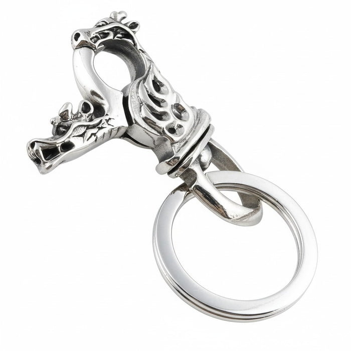 A sterling silver dragon keychain with a detailed dragon head clasp and keyring.