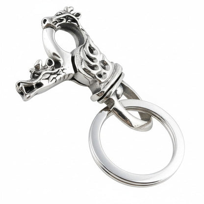 A sterling silver dragon keychain with a detailed dragon head clasp and keyring.