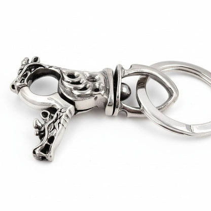A side profile of the dragon head key fob, showing its 3-inch length.