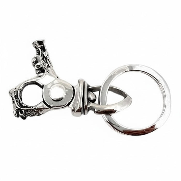 Edge view of the dragon head clasp, its pivot joint and spring clip visible beside the split key ring.