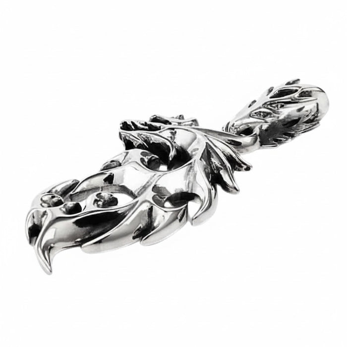 The men's tribal flame pendant demonstrate its 1x2 inch size and substantial feel.
