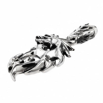 The men's tribal flame pendant demonstrate its 1x2 inch size and substantial feel.