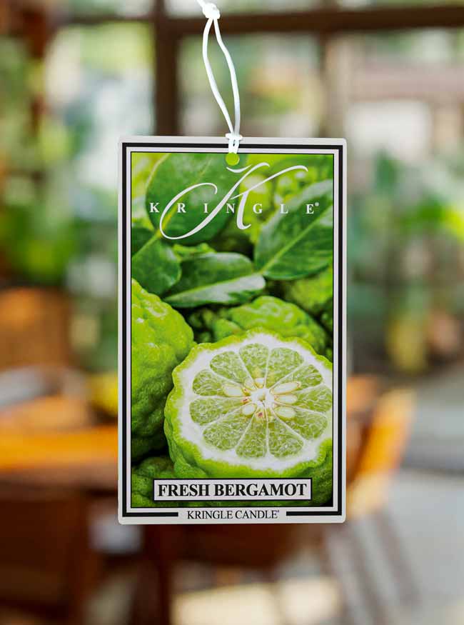 Kringle Candle Fresh Bergamot air freshener with a blurred background