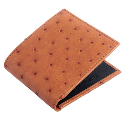 Angled view of the tan ostrich leather wallet highlighting the two-tone design with the black interior.
