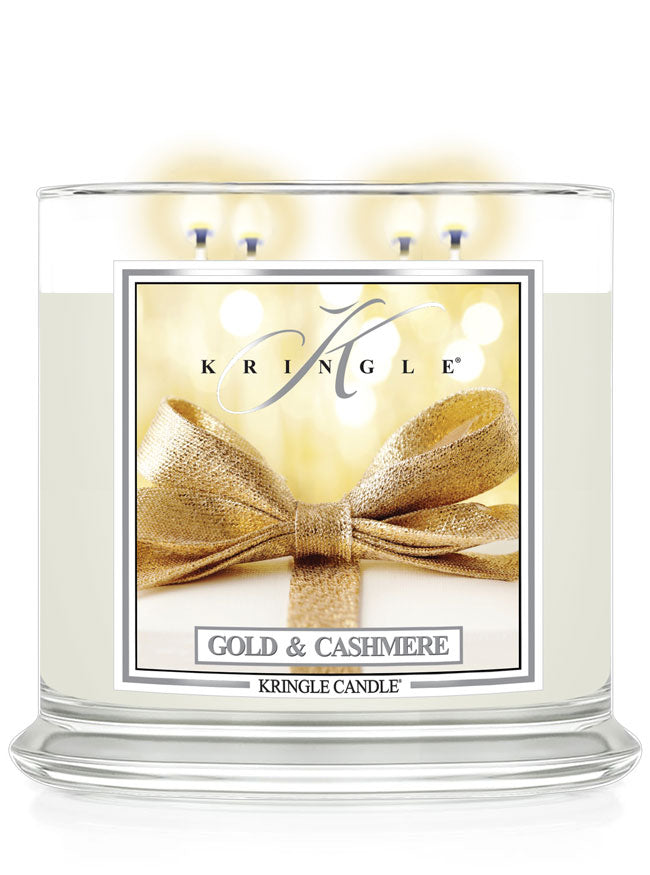Kringle Candle in Gold & Cashmere with a gold bow design on a white background