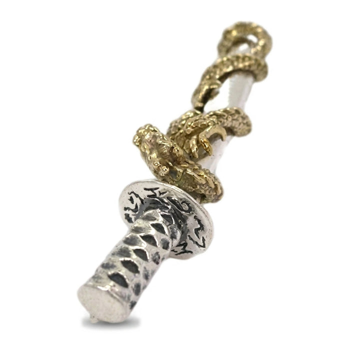Hammered diamond-faceted silver tsuka with oxidized recesses, dragon tail wrapping the upper scabbard above