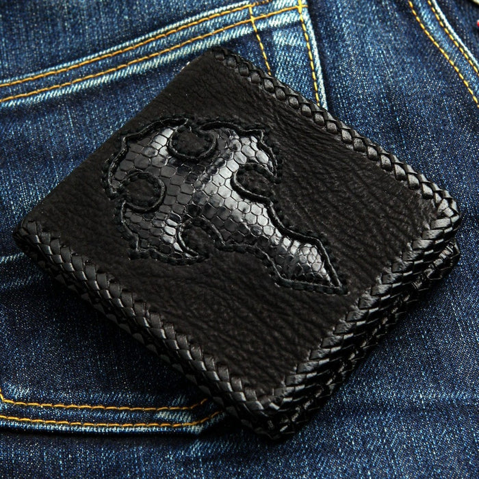 Front view of black leather biker wallet featuring a textured gothic cross inlay