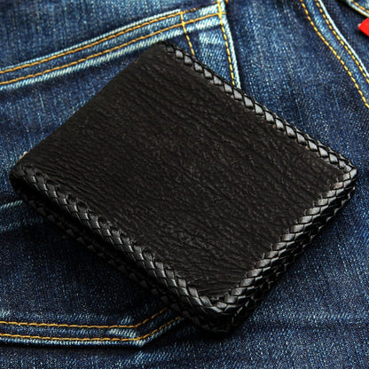 Back view of the wallet showing rugged black genuine leather texture and braided edges