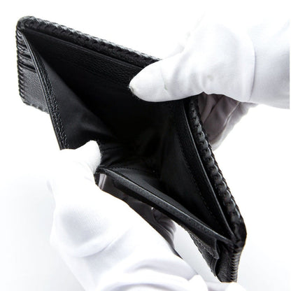 Close-up view of the bill and receipt slots inside the handmade leather wallet