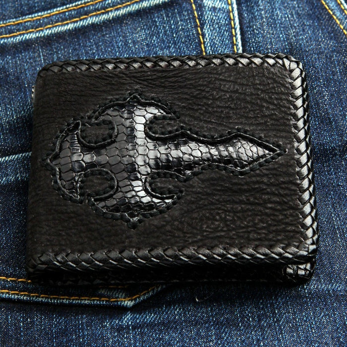 Detailed close-up of the exotic leather texture on the gothic cross inlay
