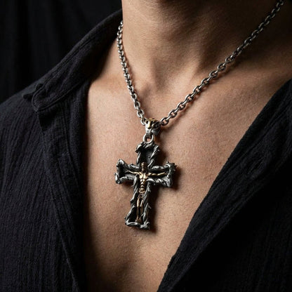 Man wearing handcrafted sterling silver Gothic crucifix pendant with gold Jesus on silver chain