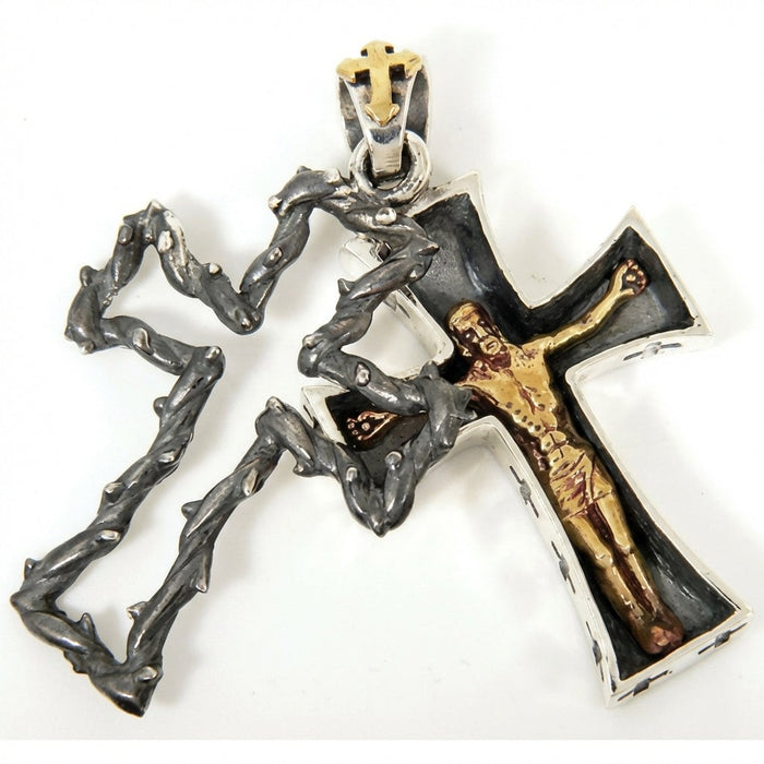 Sterling silver Gothic crucifix pendant with removable thorn overlay separated showing inner cross with golden Jesus