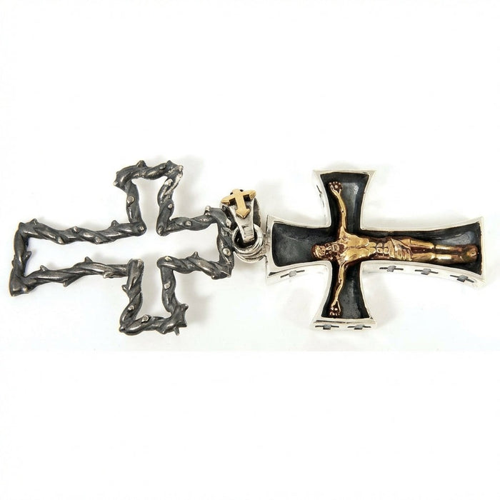 Flat lay of sterling silver crucifix pendant showing thorn frame and inner golden Jesus cross side by side
