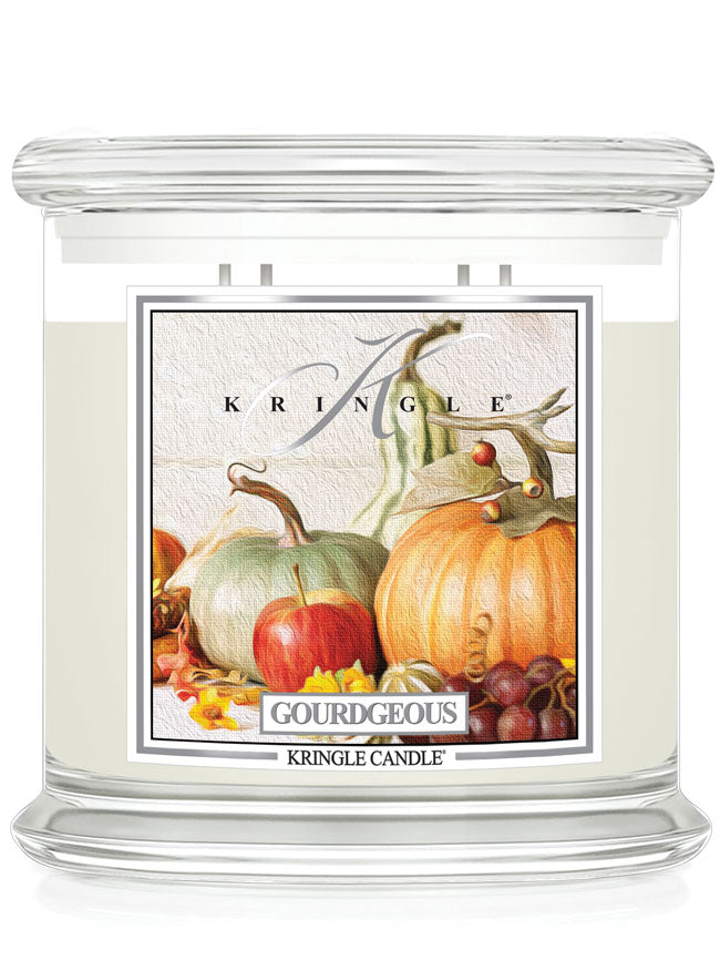 Kringle Candle with a decorative label featuring pumpkins and gourds on a white background