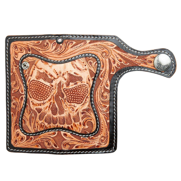The full, open exterior view of the hand-carved demon wallet, showing the floral tooling, skull face, and wallet chain grommet.