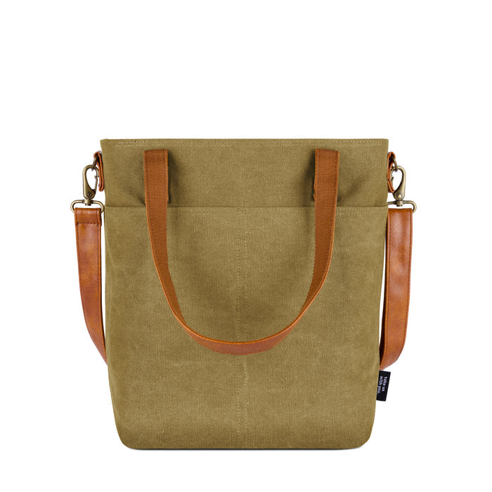 Sage green canvas tote bag with cognac brown leather handles and trim accents