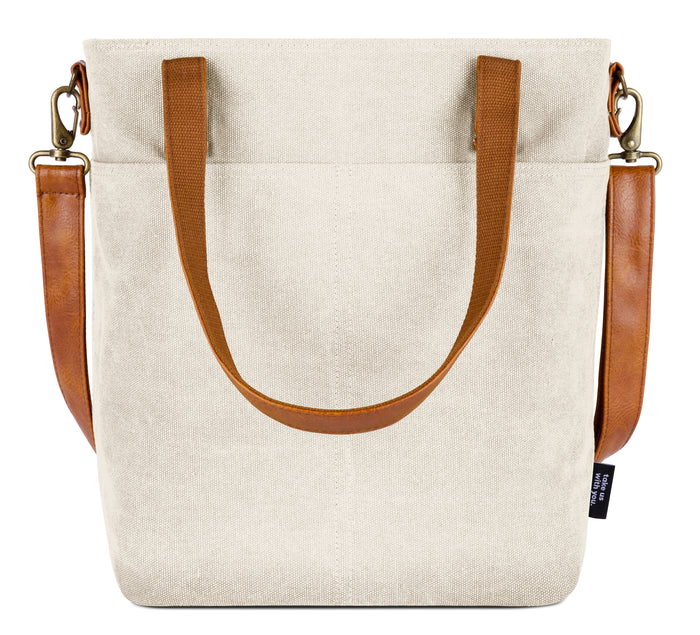 Cream canvas tote bag displayed flat against a white background, showing natural woven fabric texture and construction details.