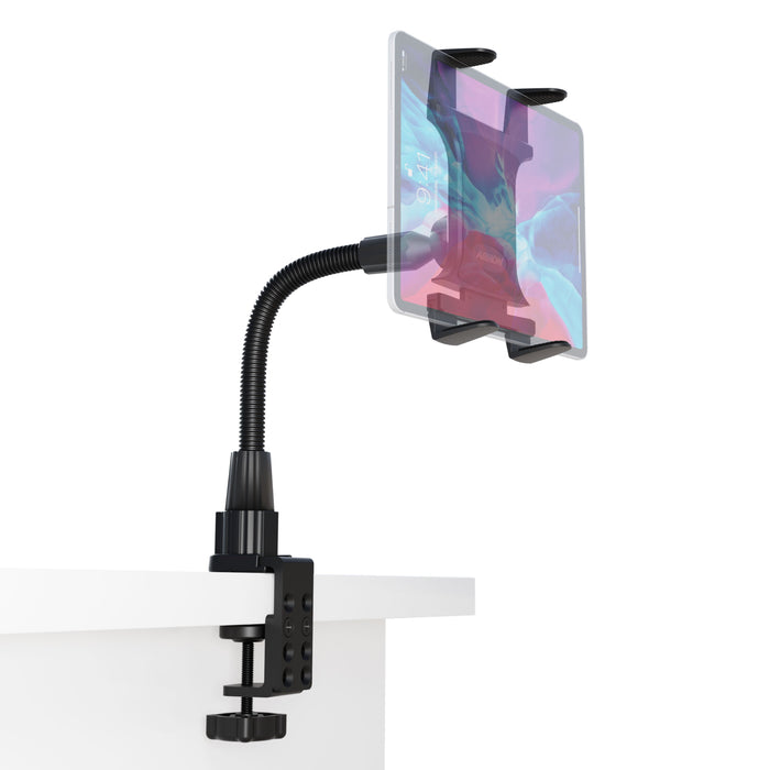 A tablet is secured by the Heavy-Duty Slim-Grip® Tablet Clamp Mount with a black clamp, attached to a white desk edge. Its flexible gooseneck arm provides customizable positioning.