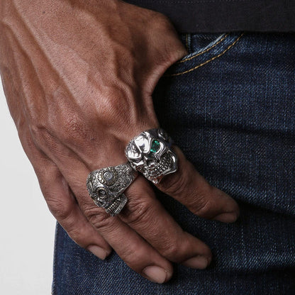 A massive 30-gram men's biker skull ring with a single green eye and a diamond accent tooth.