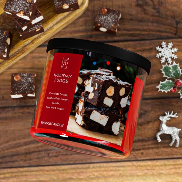 Kringle Candle Holiday Fudge candle with a red label and fudge image with a festive background