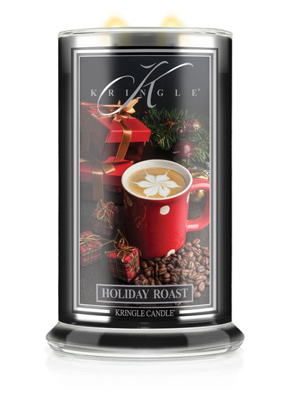 Kringle Candle with holiday design featuring a red mug and gift box on a black background.