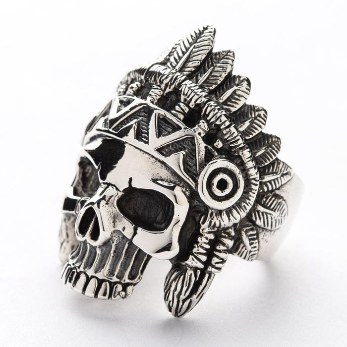 A bold biker ring featuring an Indian chief skull design with intricate hand-carved feather details.