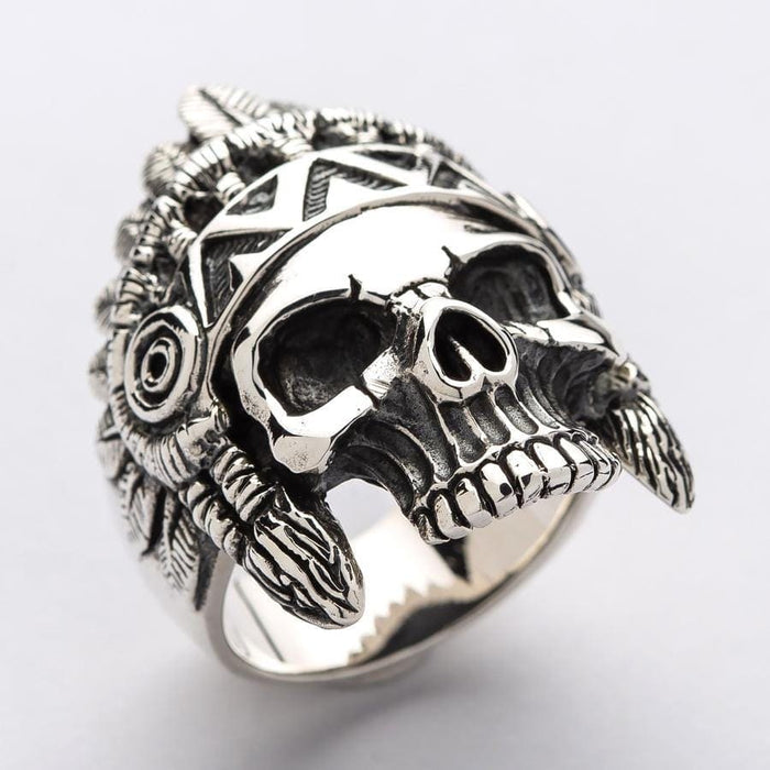 A close-up detail shot of the war bonnet and face on a men's sterling silver Indian chief ring.