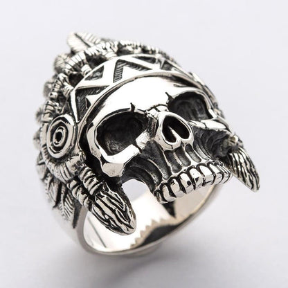 A close-up detail shot of the war bonnet and face on a men's sterling silver Indian chief ring.