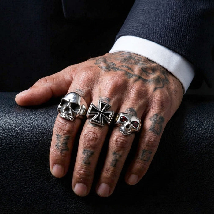 A man wearing the large sterling silver iron cross ring to show its significant size and statement style.