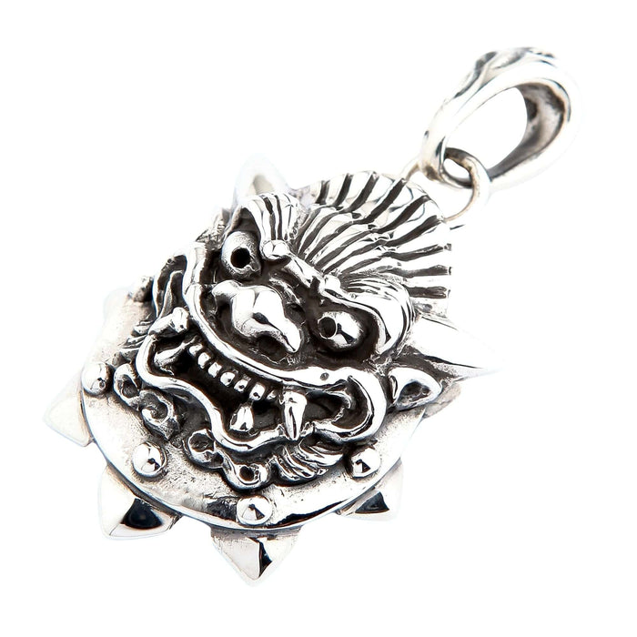 Tilted perspective of the solid silver Oni mask charm highlighting the textured mane, furrowed brow, and large bail.