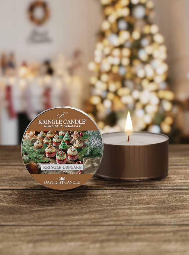Kringle Candle Daylight Candle with a Christmas tree in the background