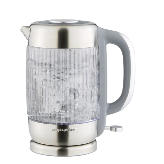 Clear glass electric kettle with silver base and handle on a white background