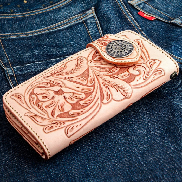 Front view of handcrafted leather long wallet featuring deep floral embossing