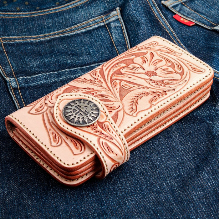 Flat back view of embossed floral leather wallet with detailed carving
