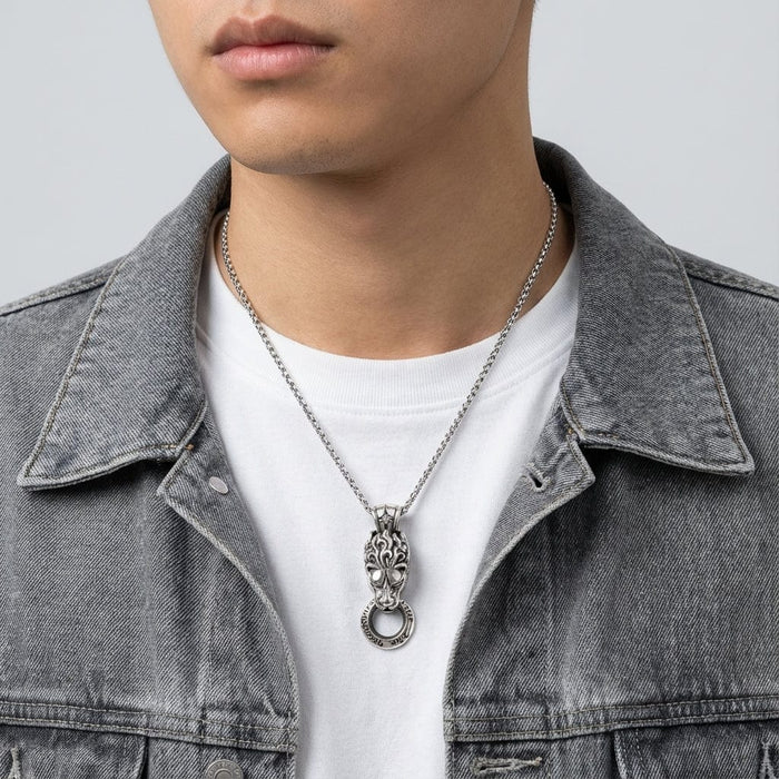 Man wearing sterling silver lion head pendant on a silver chain