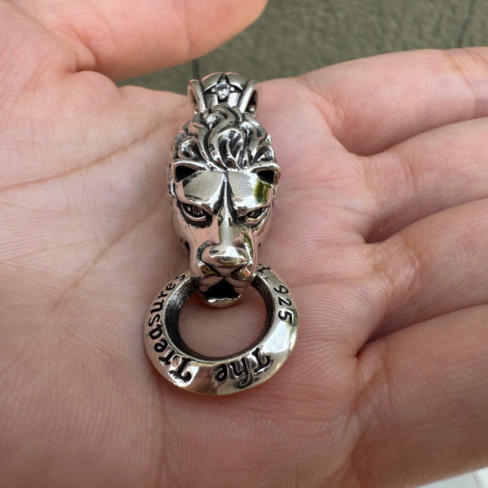 Detailed craftsmanship of silver lion mane and facial expression