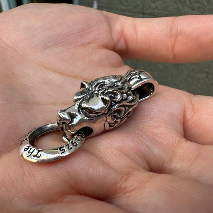 Top down view showing the bail loop on the silver lion pendant