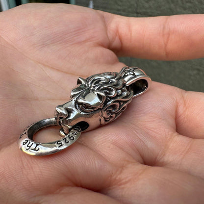 Top down view showing the bail loop on the silver lion pendant