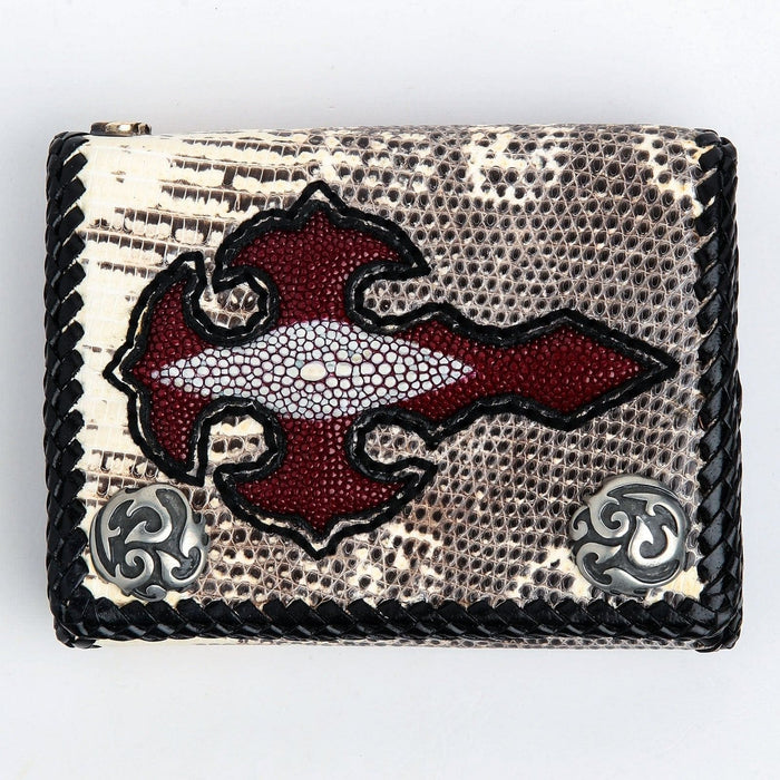 Overhead view of the lizard skin wallet face showing the red stingray cross with its natural pale spine marking, black braided edge and two silver-tone tribal conchos.