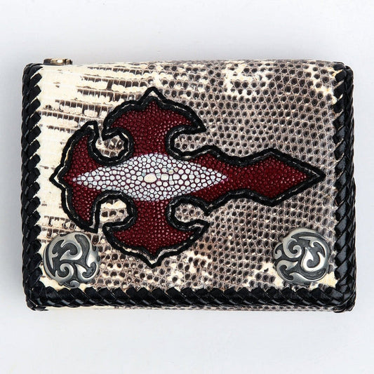 Overhead view of the lizard skin wallet face showing the red stingray cross with its natural pale spine marking, black braided edge and two silver-tone tribal conchos.