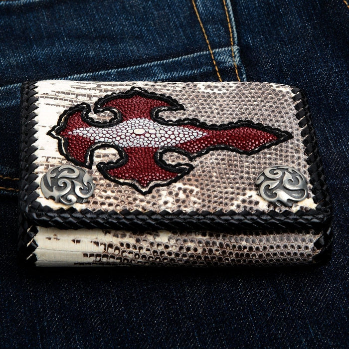 Close-up of the hand-braided black leather edge and the banded lizard scales surrounding the red stingray cross inlay.