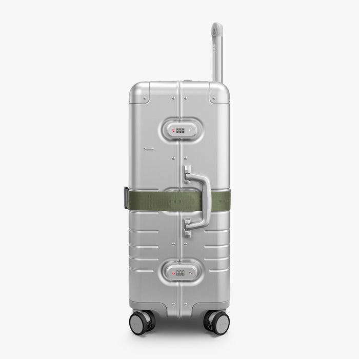 Olive Green | Side view of Aluminum suitcase with the Olive Green Luggage Strap secured around it