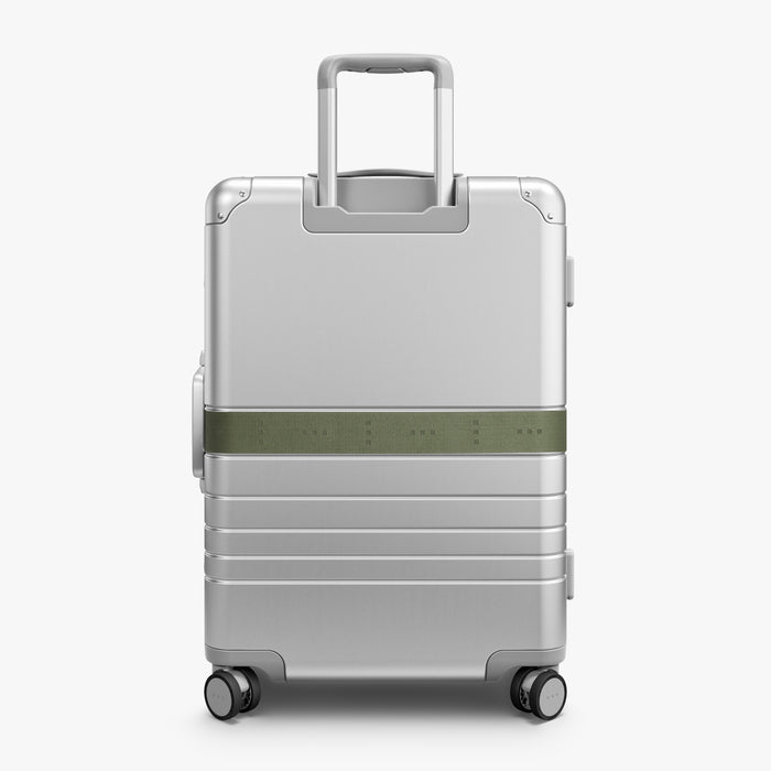 Olive Green | Back view of Aluminum suitcase with the Olive Green Luggage Strap secured around it