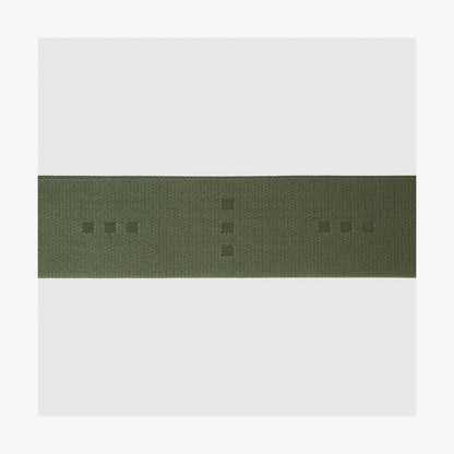 Olive Green | Close-up view of the logo detail on the Luggage Strap in Olive Green