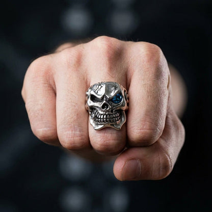 Heavy sterling silver skull ring worn on middle finger showing commanding presence