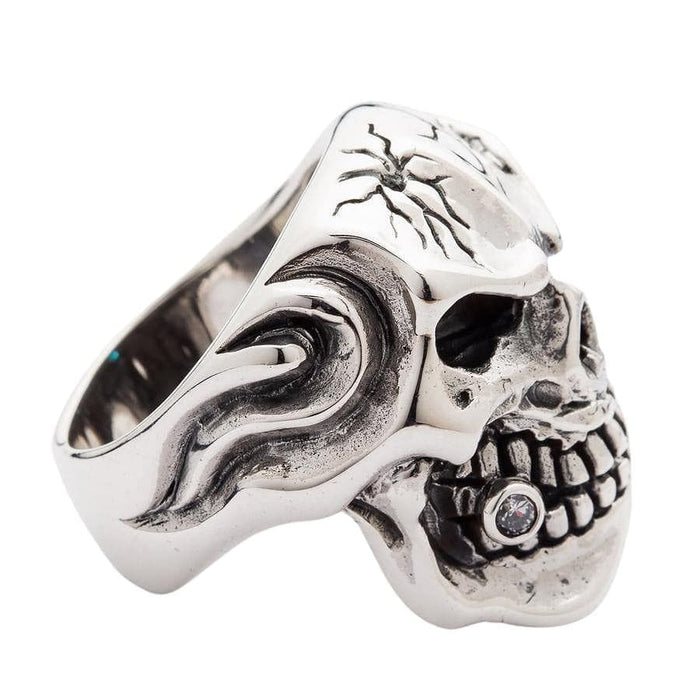 Right angle view of 925 silver skull ring showing diamond tooth and empty eye socket