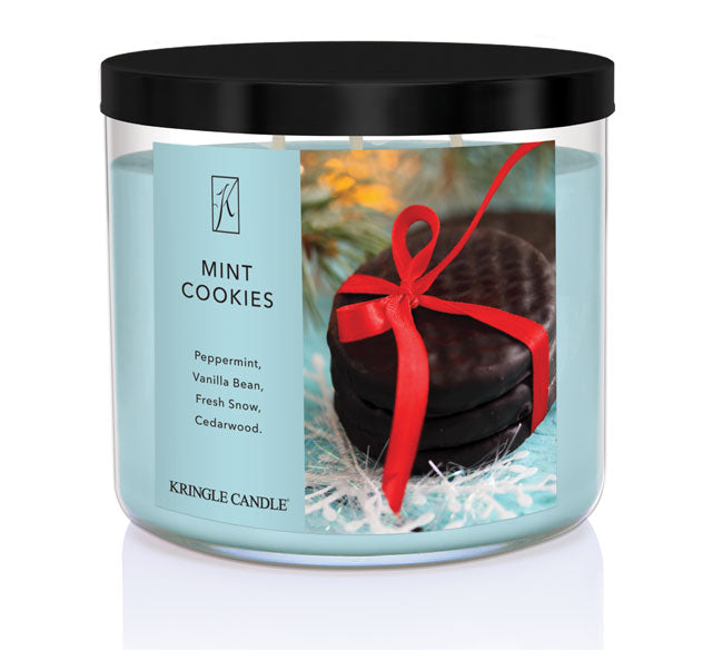 Kringle Candle mint cookies scented candle with a black lid on a white background