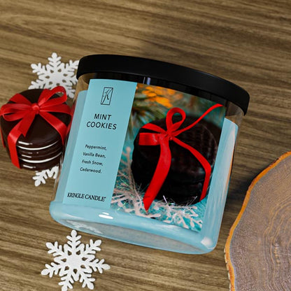 Kringle Candle mint cookies candle with decorative elements on a wooden surface