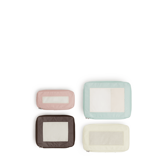 Set of Four / Multi Scaled | Set of four top view of Monos x Reformation compressible packing cubes in Multi colors