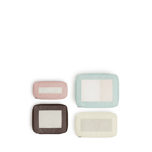Set of Four / Multi Scaled | Set of four top view of Monos x Reformation compressible packing cubes in Multi colors